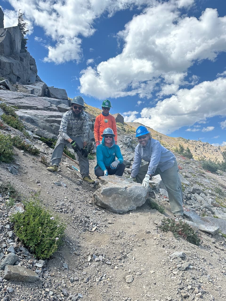 Some trail projects require a lot of strong hands, as seen here with Shawn, our local co-ordinator, and two other volunteers